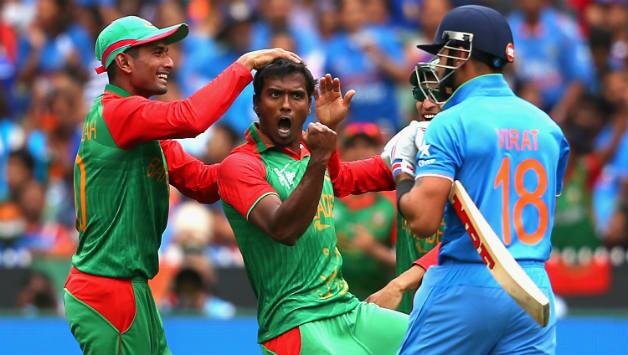 Rubel Hossain (centre) celebrates after the dismissal of Virat Kohli (right) © Getty Images