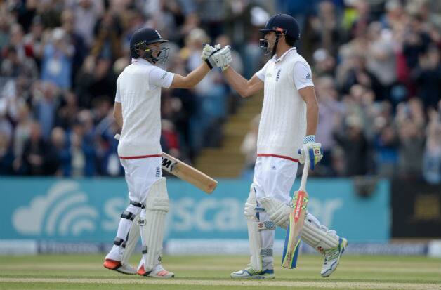 Alastair Cook (left) celebrates becoming England's highest Test run-scorer with Adam Lyth © Getty Images