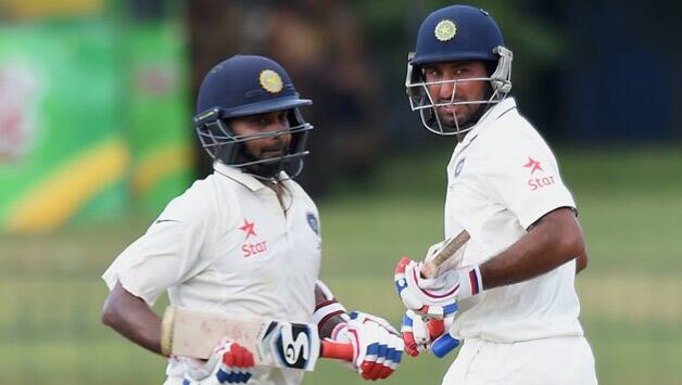 Cheteshwa Pujara and Amit Mishra put on 104 runs for the eighth wicket © AFP