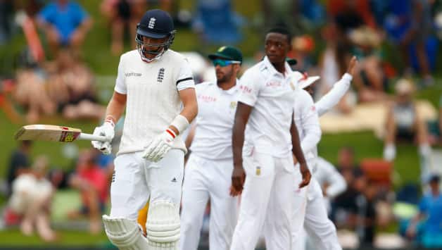 Joe Root (left) walks back to the pavilion after getting dismissed for 76 © Getty Images