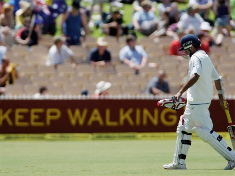 &acirc;Keep Walking&acirc;, says the hoarding in the background. In the foreground, Sourav Ganguly, head bowed, walks into the sunset &Acirc;&copy; Getty Images