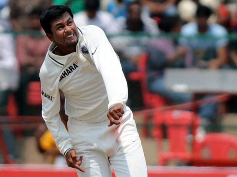 Playing for Surrey again Northamptonshire, Pragyan Ojha (above) had figures of 16.3-10-8-6 &copy; Getty Images