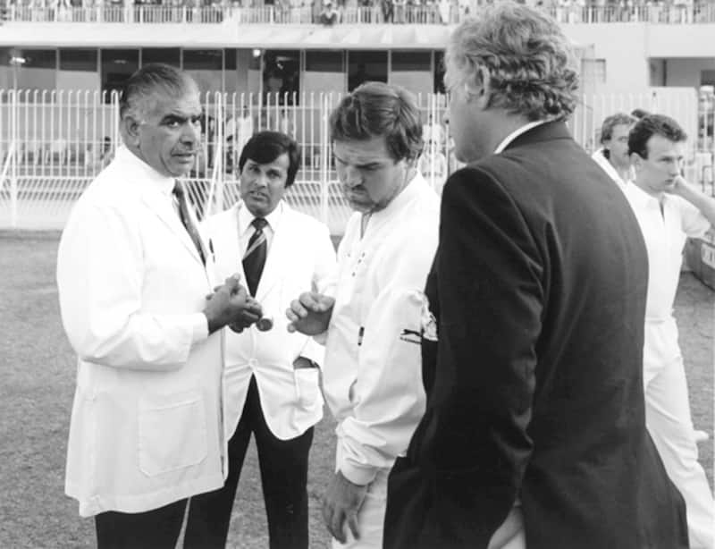 Umpire Shakoor Rana (left) and England captain Mike Gatting (head bowed) when peace was being brokered to ensure that the England-Pakistan series did not come to an abrupt half following an ugly showdown between the two gentlemen during a Test in 1987 &Acirc;&copy; Getty Images