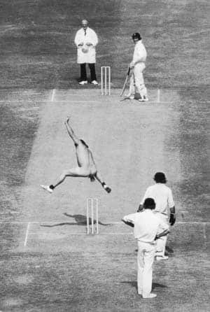 Streaker Michael Angelow, a merchant seaman, hurdles over the wicket at the non-striker's end at the Lord's cricket ground during a Ashes Test in 1975 © Getty Images