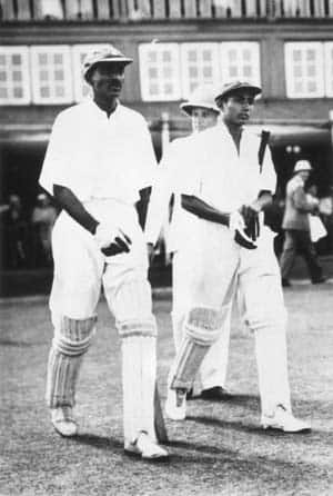 CK Nayudu (left) and Lala Amarnath walk out to bat at Bombay Gymkhana © Getty Images
