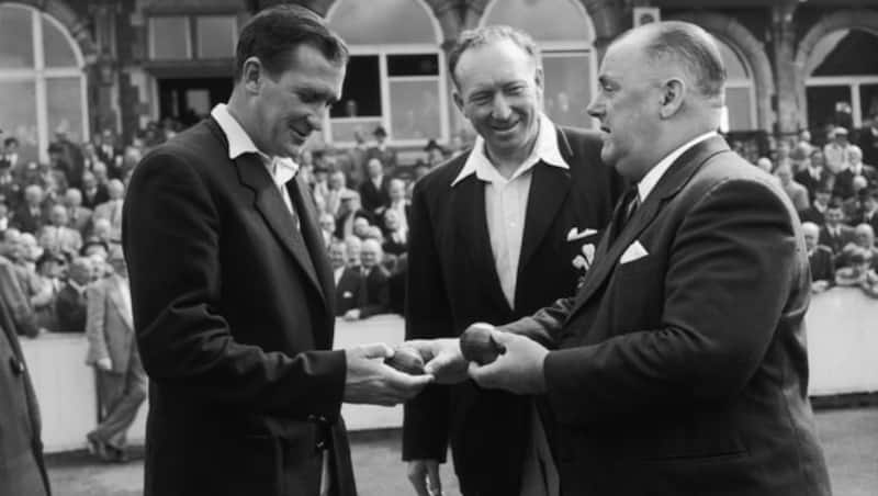 Jim Laker is presented with the two balls with which he took 9 and 10 wickets in the 1956 Old Trafford Test against Australia &Acirc;&copy; Getty Images