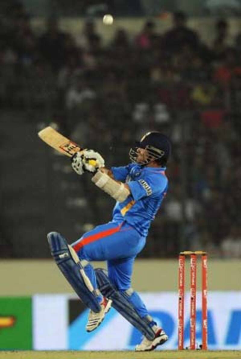 Sachin Tendulkar hits an uppercut off Pakistan's Aizaz Cheema &Acirc;&copy; AFP