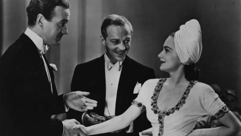 David Niven (centre) stars with Olivia De Havilland (left) and Douglas Walton in the Samuel Goldwyn film Raffles, based on the novel 'Raffles The Amateur Cracksman' by E W Hornung and directed by Sam Wood &Acirc;&copy; Getty Images