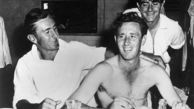 A shirtless Brian Statham congratulated by Ted Dexter (left) and Fred Trueman in the England dressing-room in 1963 after he broke the world record to become the highest wicket-taker in Tests © Getty Images