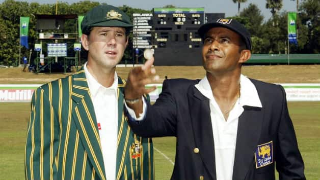 Hashan Tillakaratne (right) captain of Sri Lanka tosses the coin as Australian captain Ricky Ponting looks on at Galle in 2004 © Getty Images