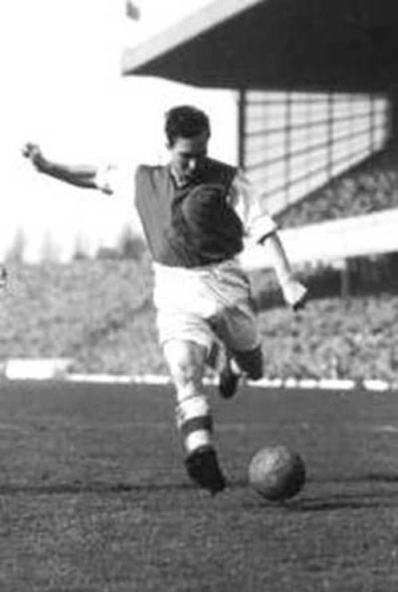 Denis Compton, seen here playing for Arsenal, used his footballing skills to run out Vijay Merchant &copy; Getty Images