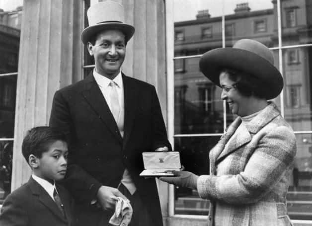 Basil D'Oliveira with wife Naomi and son Damian at Buckingham Palace where he has just been presented with an OBE by the Queen. Damian went on to to play for Worcestershire, as did Damian's son Brett © Getty Images