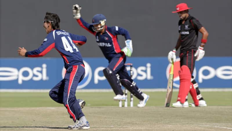 Shakti Gauchan of Nepal leads the celebrations of a wicket during the Hong Kong v Nepal Quarter Final match 60 at the ICC World Twenty20 Qualifiers at the Zayed Cricket Stadium on November 27, 2013 in Abu Dhabi, United Arab Emirates &Acirc;&copy; Getty Images 