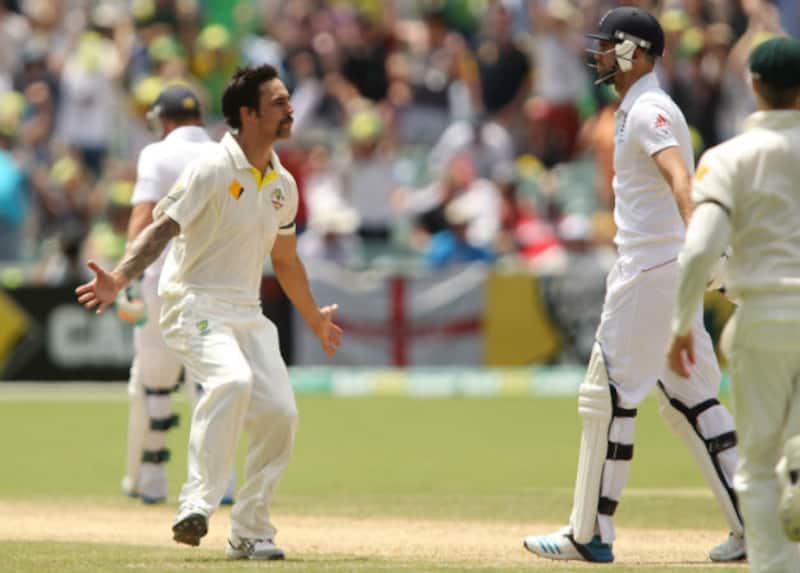Mitchell Johnson (left) stares at James Anderson after bowling him out in England's first innings &Acirc;&copy; Getty Images