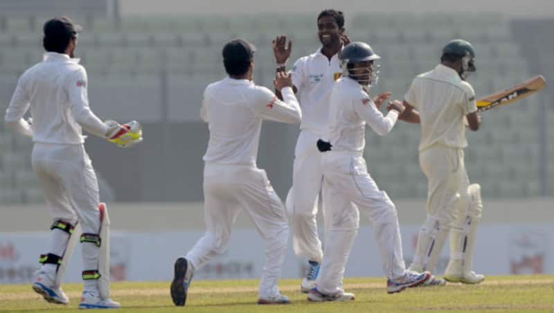 Shaminda Eranga (centre) celebrates with his Sri Lankan teammates &Acirc;&copy; AFP