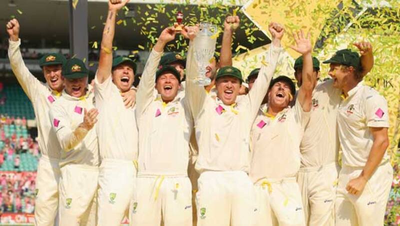 The Australian players celebrate lifting the urn after winning the 2013-14 Ashes series. They whitewashed England 5-0 &Acirc;&copy; Getty Images