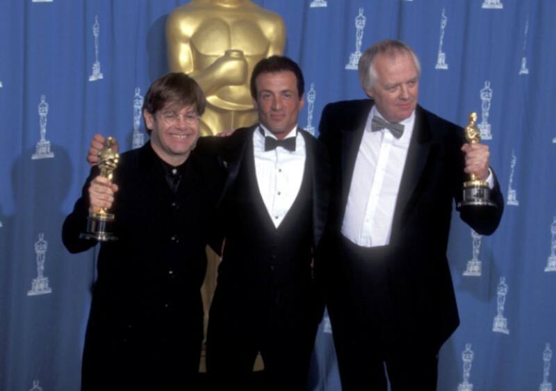 From left: Elton John, Sylvester Stallone (presenter), Tim Rice at Academy Awards, 1995 &Acirc;&copy; Getty Images
