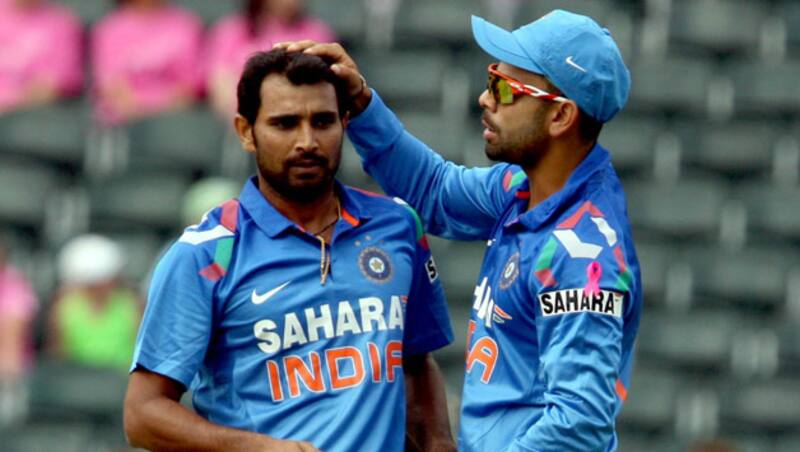 Mohammad Shami (left) claimed his first T20 wicket &Acirc;&copy; Getty Images 