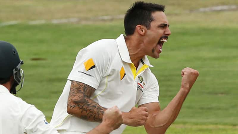 Mitchell-Johnson-of-Australia-celebrates-after-getting-the-wicket-of-Hashim-Amla-of-South-Af