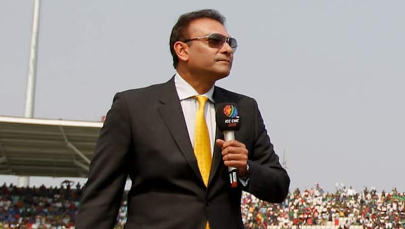 Commentator-Ravi-Shastri-and-Captain-MS-Dhoni-of-India-look-on-as-Captain-Shak