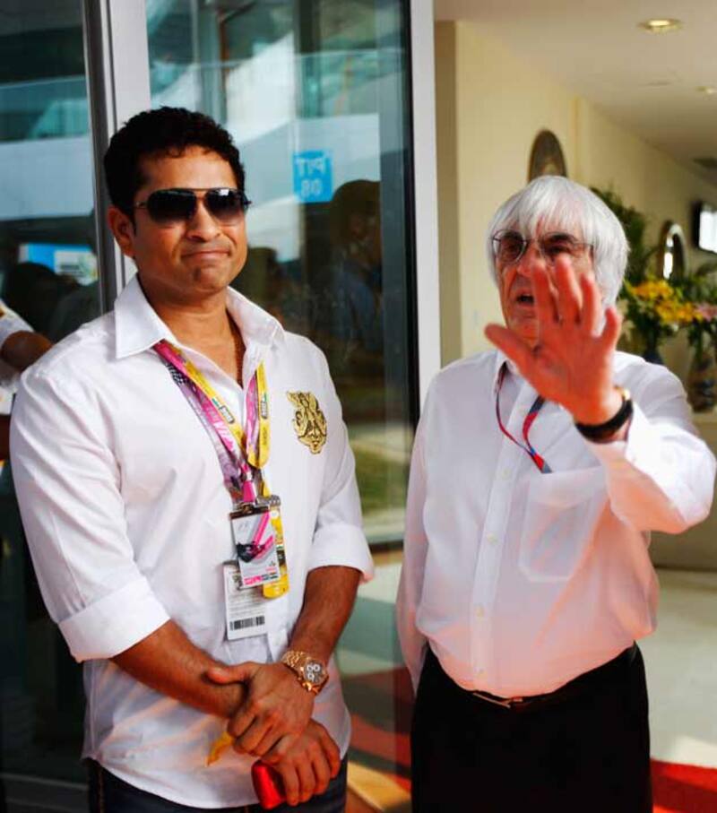 Sachin Tendulkar (left) with F1 boss Bernie Ecclestone during the Indian GP in 2011 &copy; Getty Images