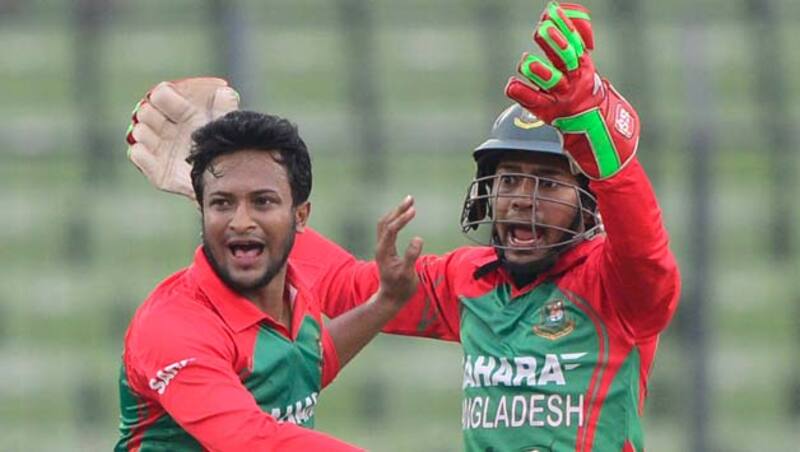 Bangladeshi-cricket-captain-Mushfiqur-Rahim-(R)-and-Shakib-Al-Hasan-(L)-react-after-the-dismissal-of-the-Indian-cri