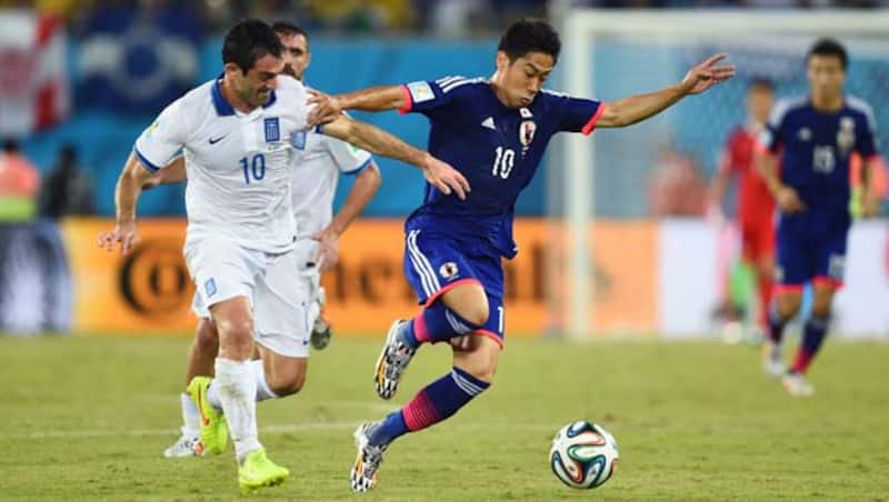 Shinji Kagawa (right) could not help Japan get a goal against Greece &Acirc;&copy; Getty Images
