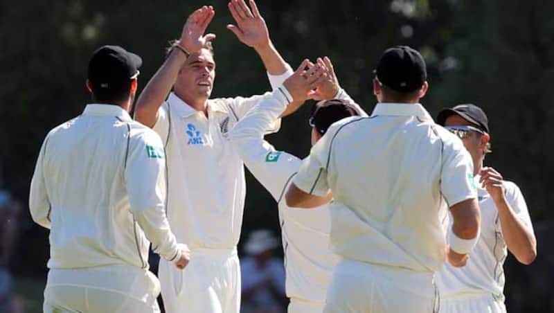 New-Zealand-players-rush-to-congratulate-Tim-Southee-after-claiming-a-West-Indies-wicket-during-day-two-of-the-first-test