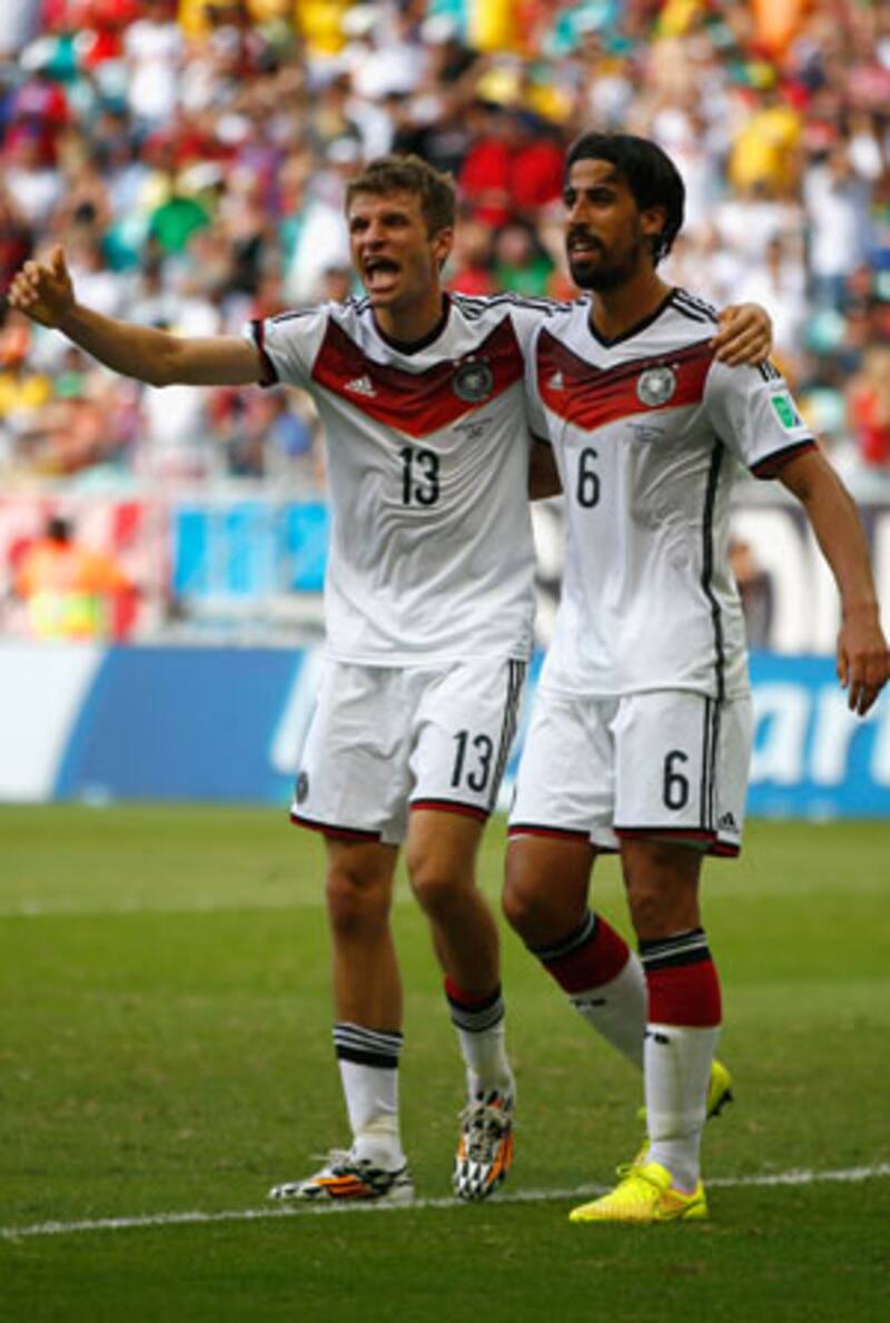 Thomas Muller (left) scored a hat-trick for Germany © Getty Images