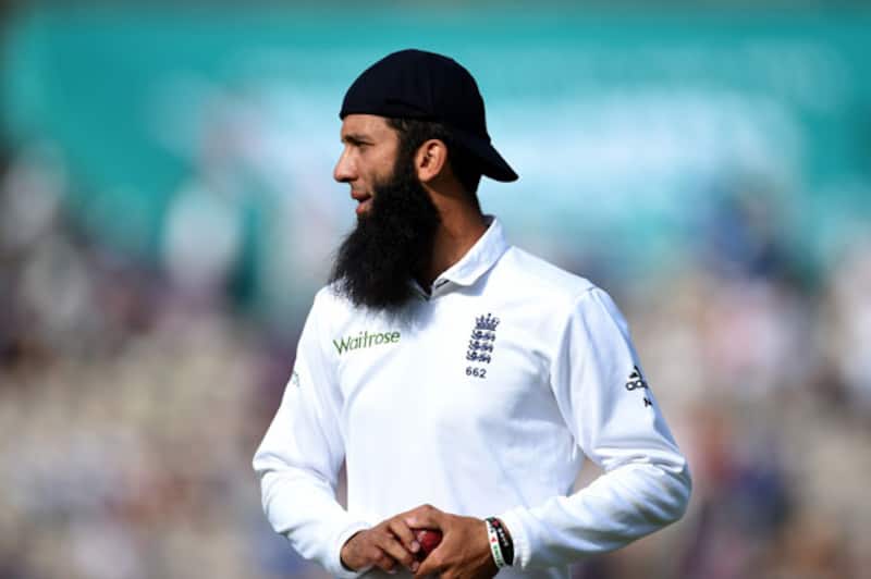 England-player-Moeen-Ali-looks-on-whilst-wearing-his-cap-back-to-front-2