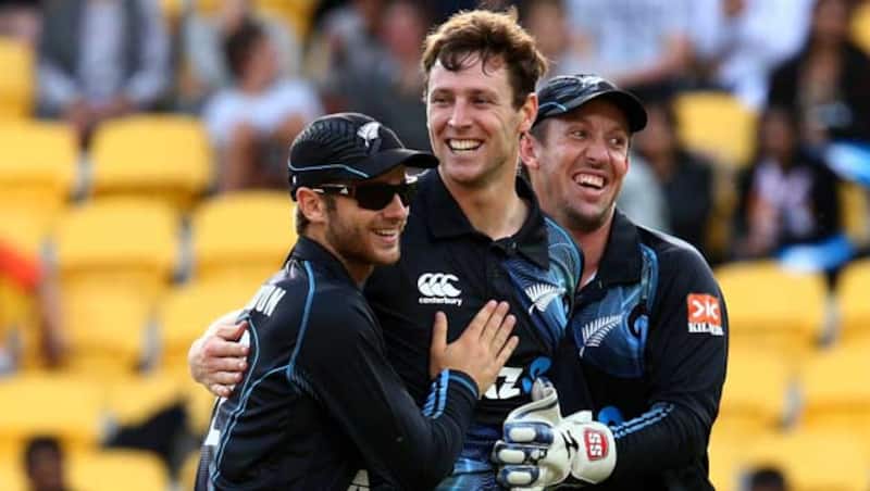 Matt-Henry-of-New-Zealand-(C)-celebrates-his-wicket-of-Shikhar-Dhawan-of-India-with-Ka