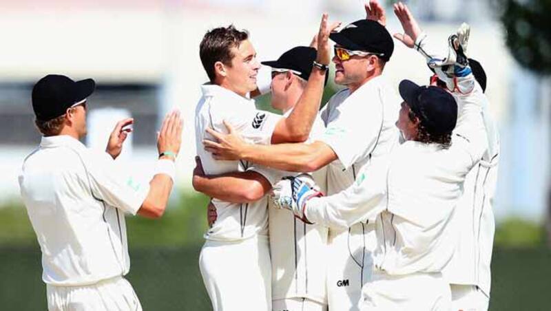 Tim-Southee-of-New-Zealand-celebrates-the-wicket-of-Marlon-Samuels-of-the-West-Indies-with-his-team-during-da