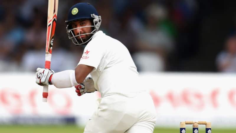 Cheteshwar Pujara (above) was caught by Jos Buttler &Acirc;&copy; Getty Images