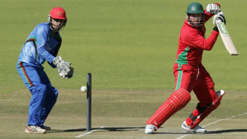     Zimbabwe captain Brendan Taylor plays a square cut as Afghanistan wicket-keeper Shafiqullah looks on &Acirc;&copy; AFP 