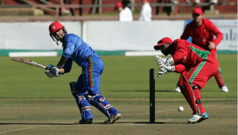 Afghanistan opener Noor Ali Zadran plays a shot while Zimbabwean wicket-keeper Regis Chakabva looks on in the first ODI at Bulawayo &Acirc;&copy; AFP