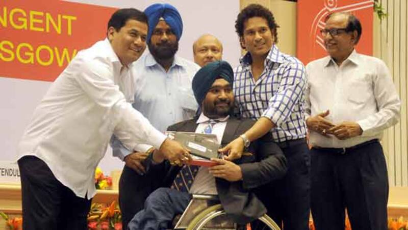Union Sports Minister Sarbananda Sonowal (extreme left) at a 2014 Glasgow Commonwealth Games felicitation ceremony with Sachin Tendulkar on August 8 in New Delhi &Acirc;&copy; IANS
