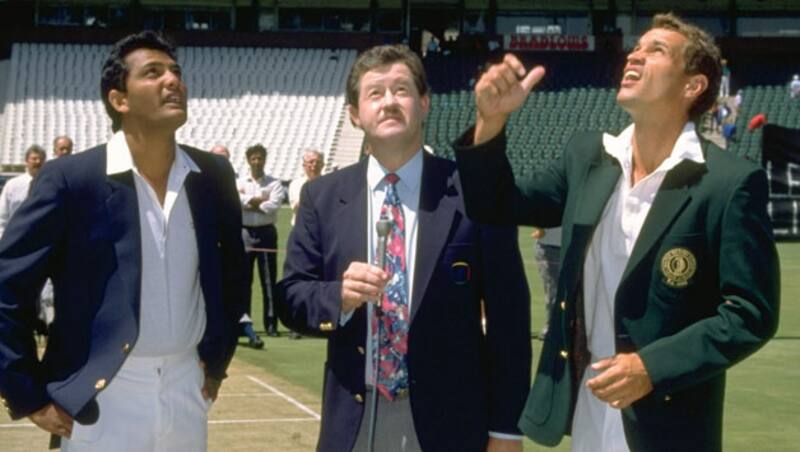 Kepler Wessels (right) tosses the coin as South Africa host an international team for the first time since their excommunication &Acirc;&copy; Getty Images