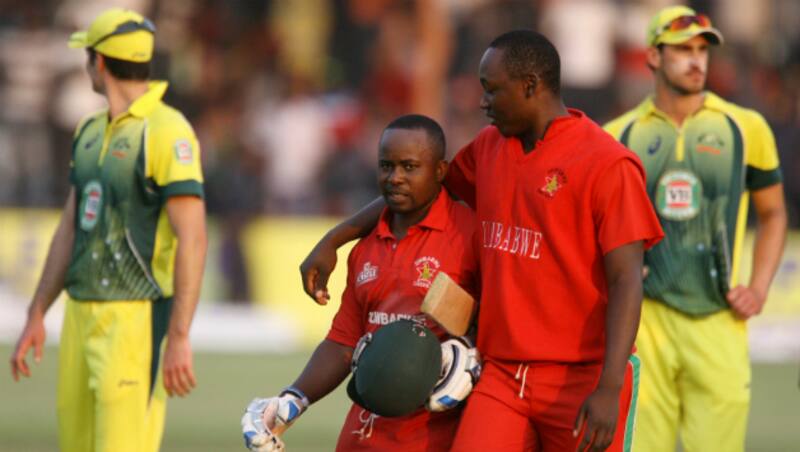 Prosper Utseya (left) and Elton Chigumbura put up an unbeaten 55-run stand for the eighth-wicket to guide Zimbabwe to an unlikely victory over Australia &copy; AFP