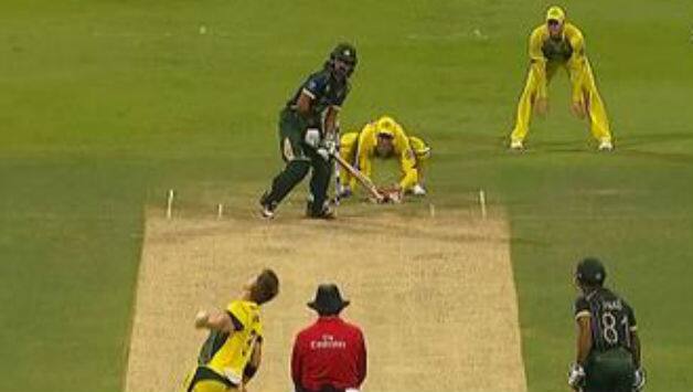 Steven Smith is in position at first slip and Fawad Alam is getting ready to face the ball.