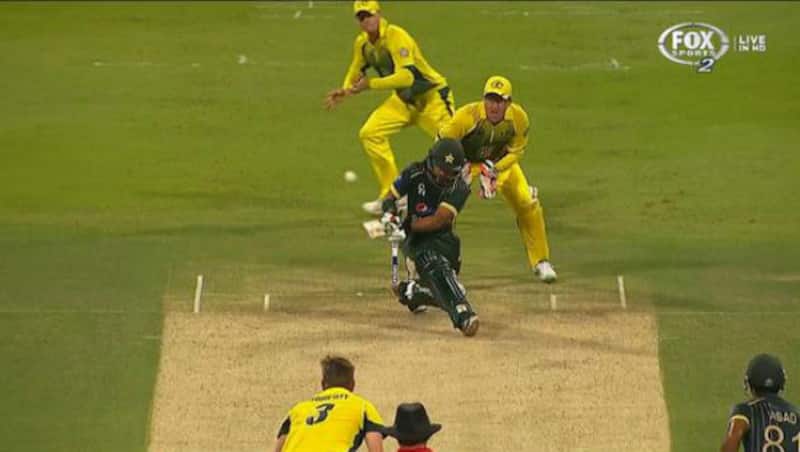 Fawad Alam has played the sweep and Steven Smith has one foot on the leg-side, getting ready to take the catch.