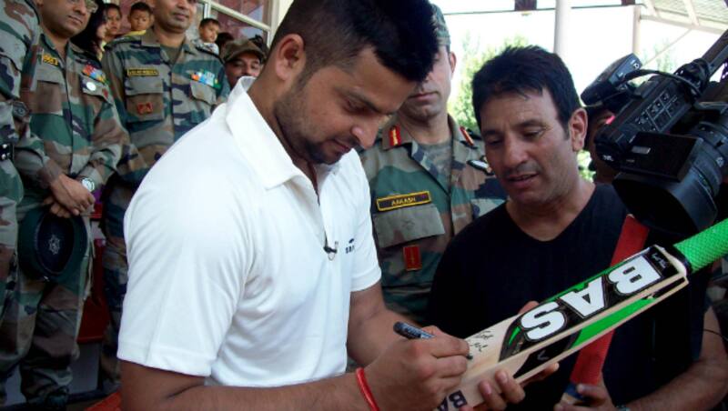 Suresh Raina presented  Aditya Garhwal an autographed bat and even Delhi Daredevils scouts monitoring his performance &Acirc;&copy; IANS (File Photo)