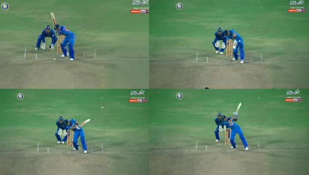 Dhoni hitting his famous helicopter shot