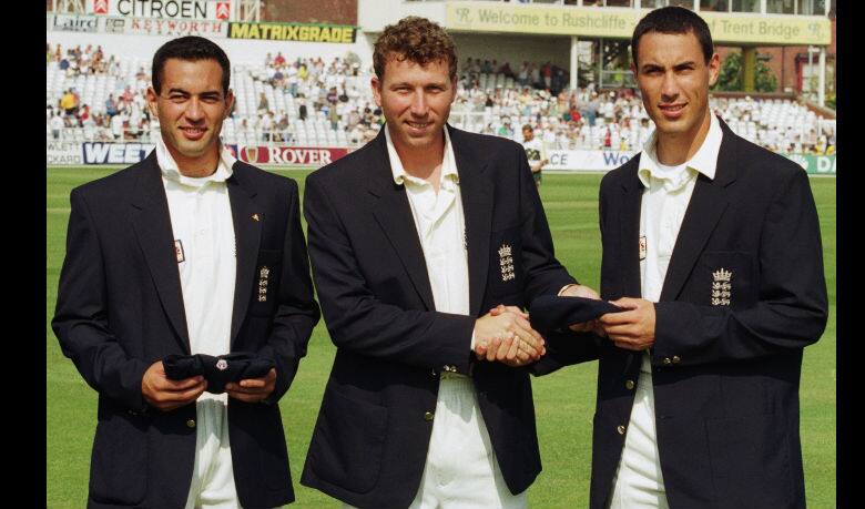 Adam Hollioake (left) and younger brother Ben made their Test debut in the same match. Here they are receiving their caps from Michael Atherton (centre) © Getty Images