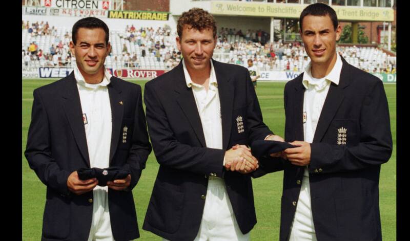 Adam Hollioake (left) and younger brother Ben made their Test debut in the same match. Here they are receiving their caps from Michael Atherton (centre) &copy; Getty Images