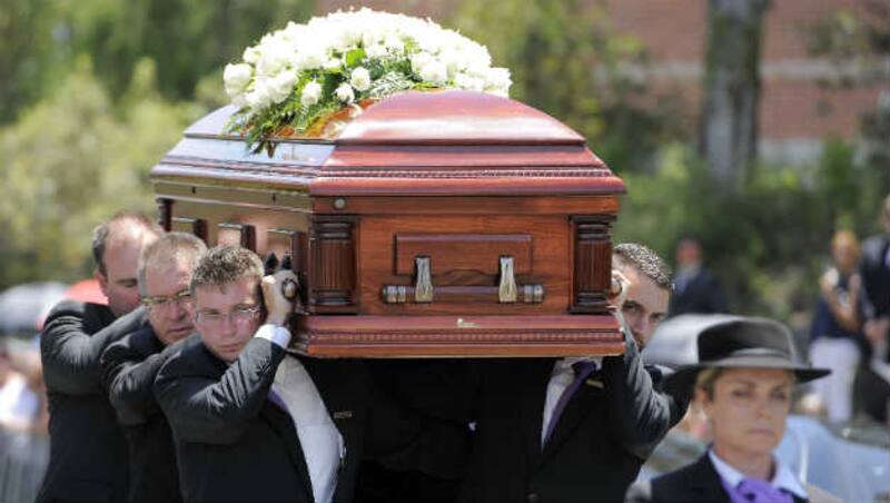 Phil Hughes' coffin being carried by pallbearers © Getty Images