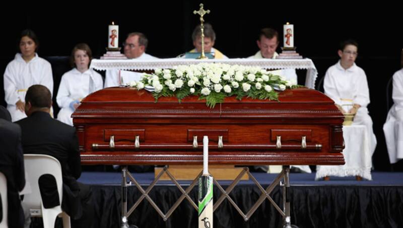 Phillip Hughes's cricket bat rests against his coffin during the Funeral Service for Phillip Hughes at Macksville High School Stadium on December 3, 2014 in Macksville, Australia. 