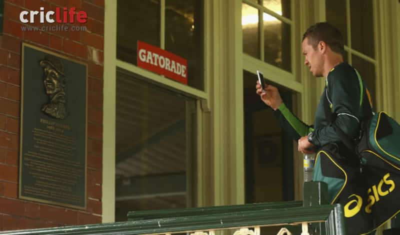 Peter Siddle takes a photo of the commemorative plaque erected in a tribute to the late Phil Hughes at SCG &Acirc;&copy; Getty Images
