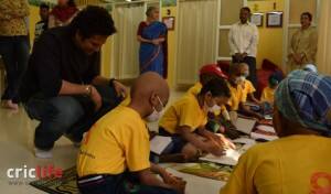 Sachin looking at the children's work of art