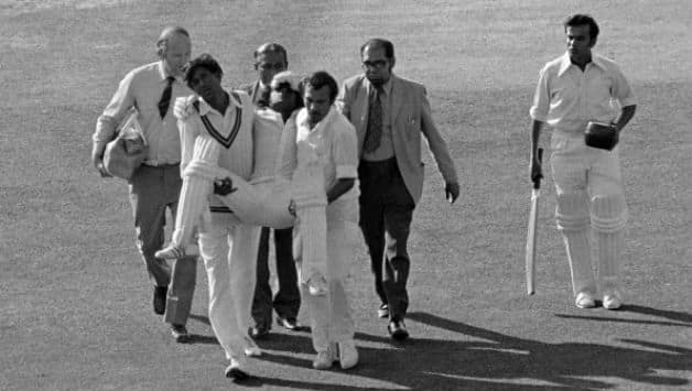 Duleep Mendis being carried off the ground after being hit by Jeff Thomson © Getty Images