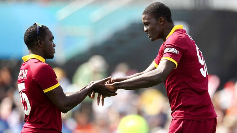 Jerome Taylor's (left) brilliant bowling has earned the support of skipper, Jason Holder &copy; Getty Images
